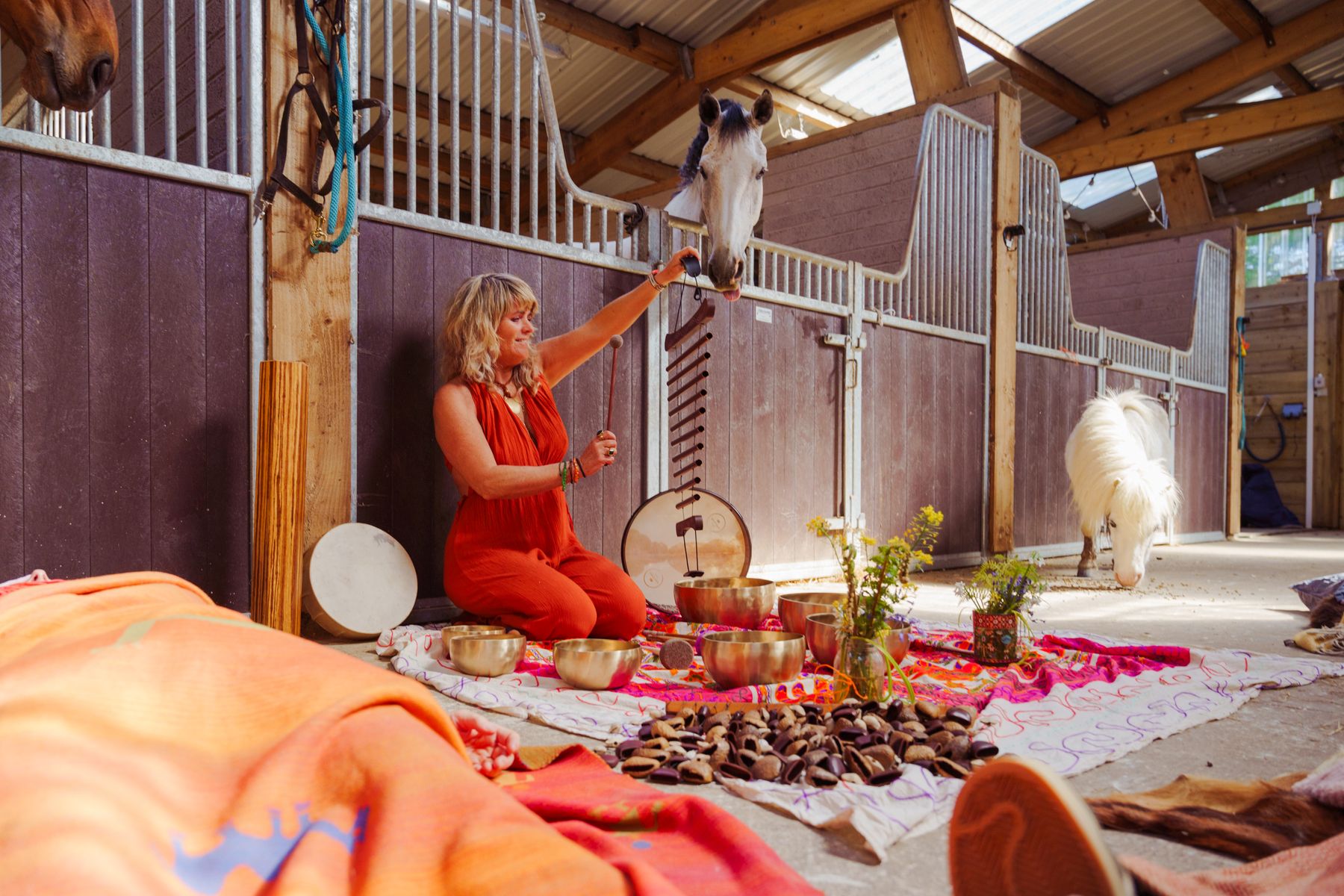 Wide view of the sound bath set out on the barn floor