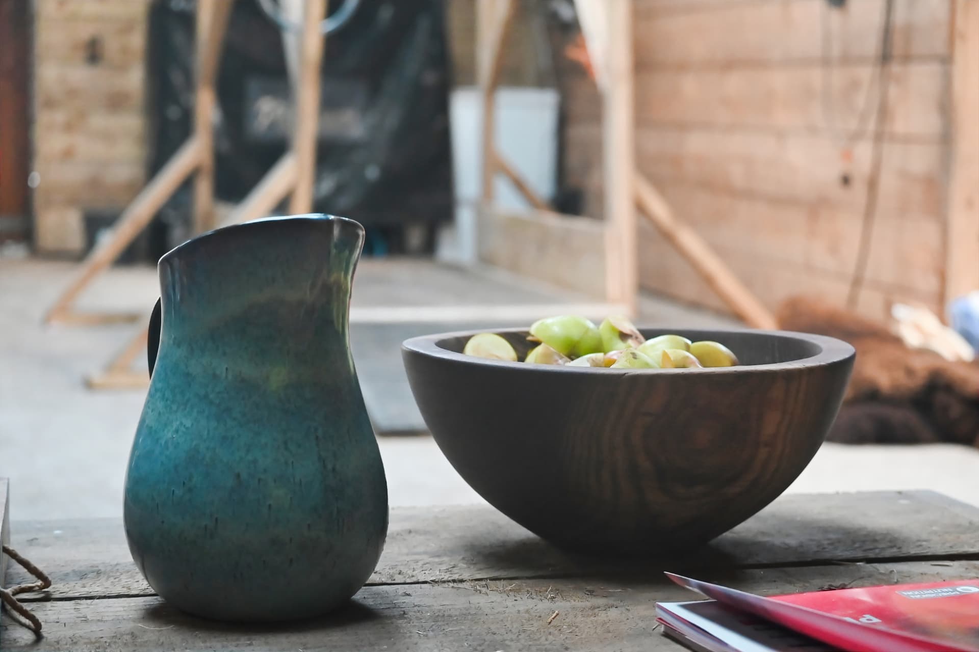 A crystal singing bowl glowing with soft purple light on a pink embroidered cloth
